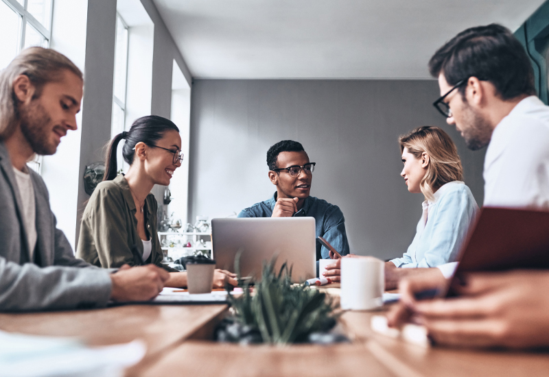 Managers participating in a process safety management briefing and group discussion.