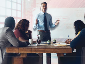 Instructor leading a process safety training session with participants in a classroom setting.
