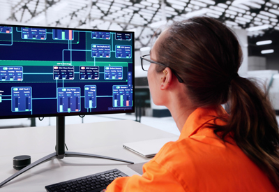 Process safety engineer reviewing P&ID diagrams while assigning nodes during a HAZOP study